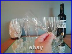 11 verres en cristal estampille Baccarat modèle Don Perignon. H 19cm