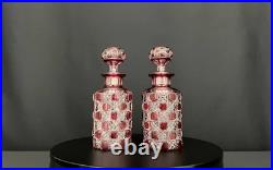 Paire de flacons anciens en cristal taillé rouge rubis Maison Baccarat Paire de flacons anciens en cristal taillé rouge rubis Maison Baccarat